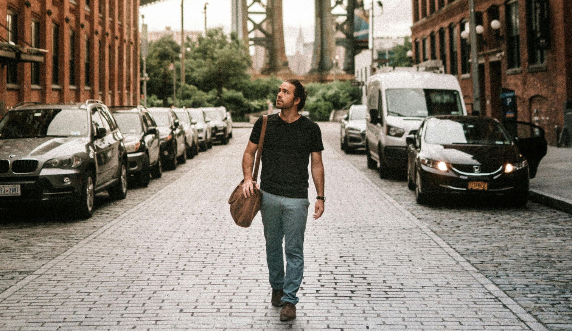 Man In Black T-shirt And Blue Denim Walking